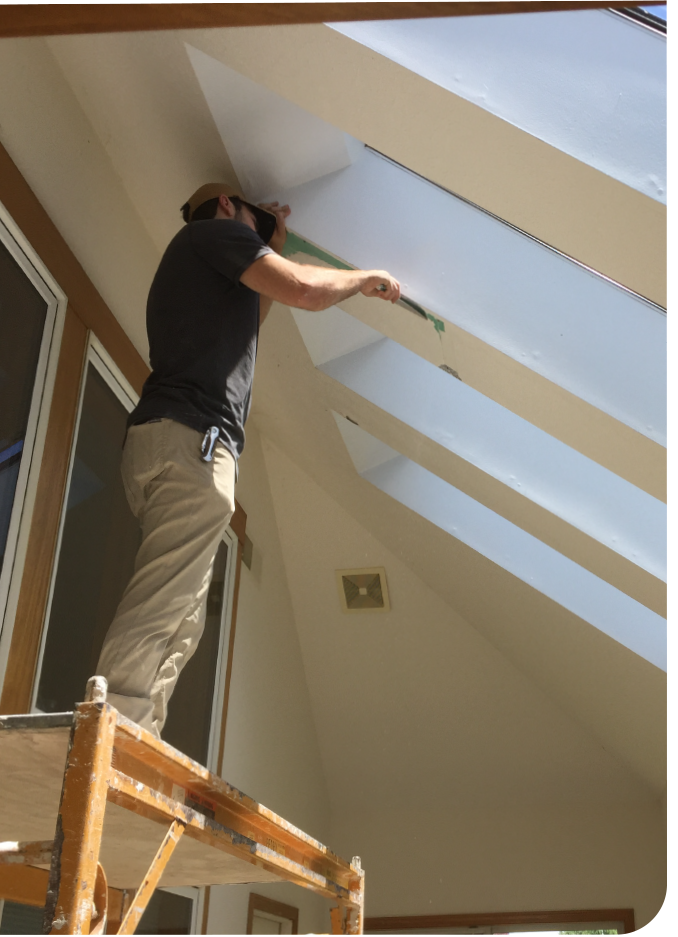 image2 Professional drywall technician repairing and blending ceiling texture around skylights for a clean, photo-ready finish before home sale.